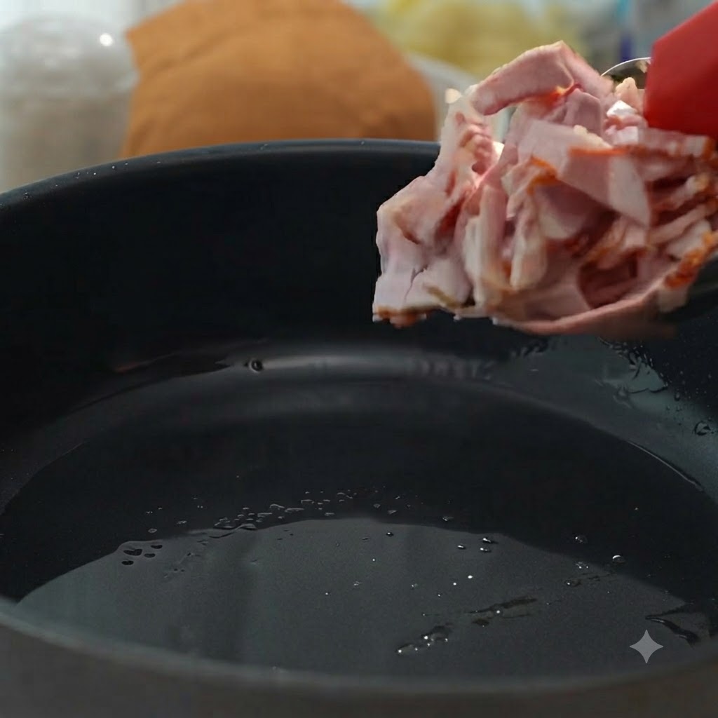カリッとこんがり焼き上げるために、パンにベーコンのピースを入れている様子。