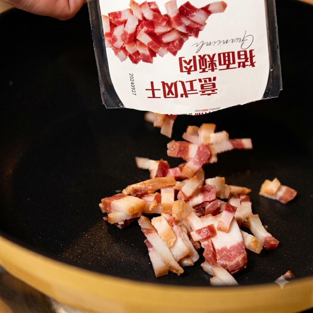パッケージから熱した黒いフライパンへと、イタリア産の豚ほお肉のピースが落ちていく瞬間